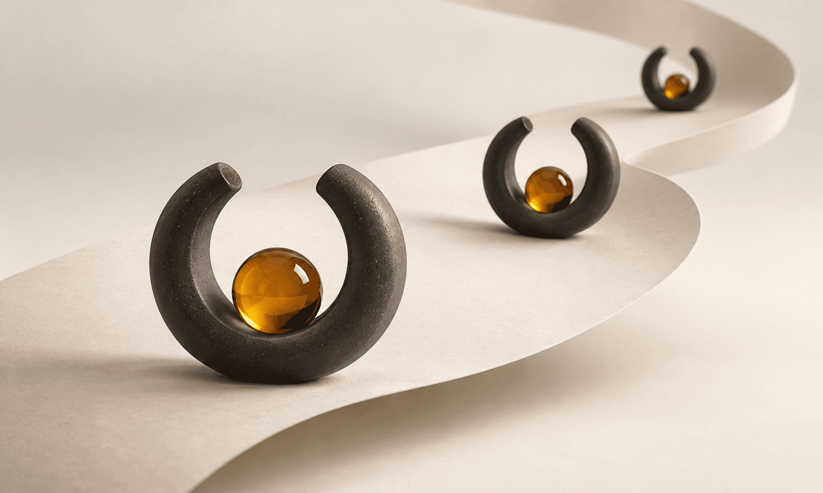 Repeating charcoal rings and amber spheres along a curved ivory ribbon
