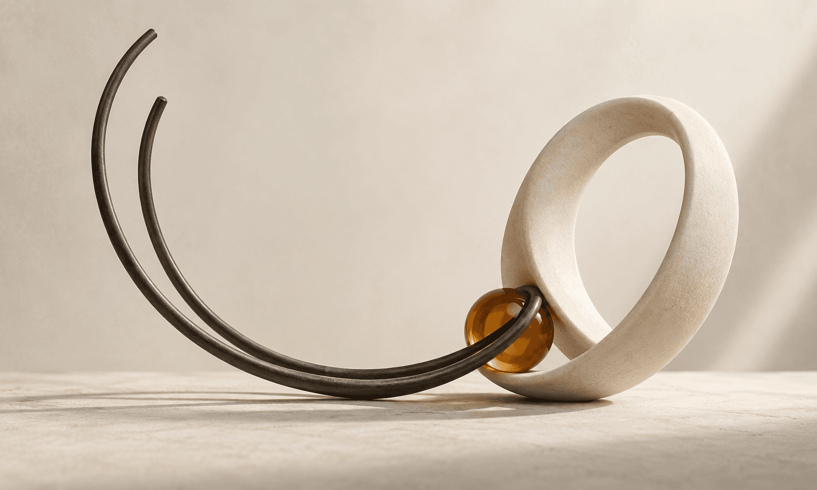 Open charcoal wire curves beside a solid ivory loop and amber join