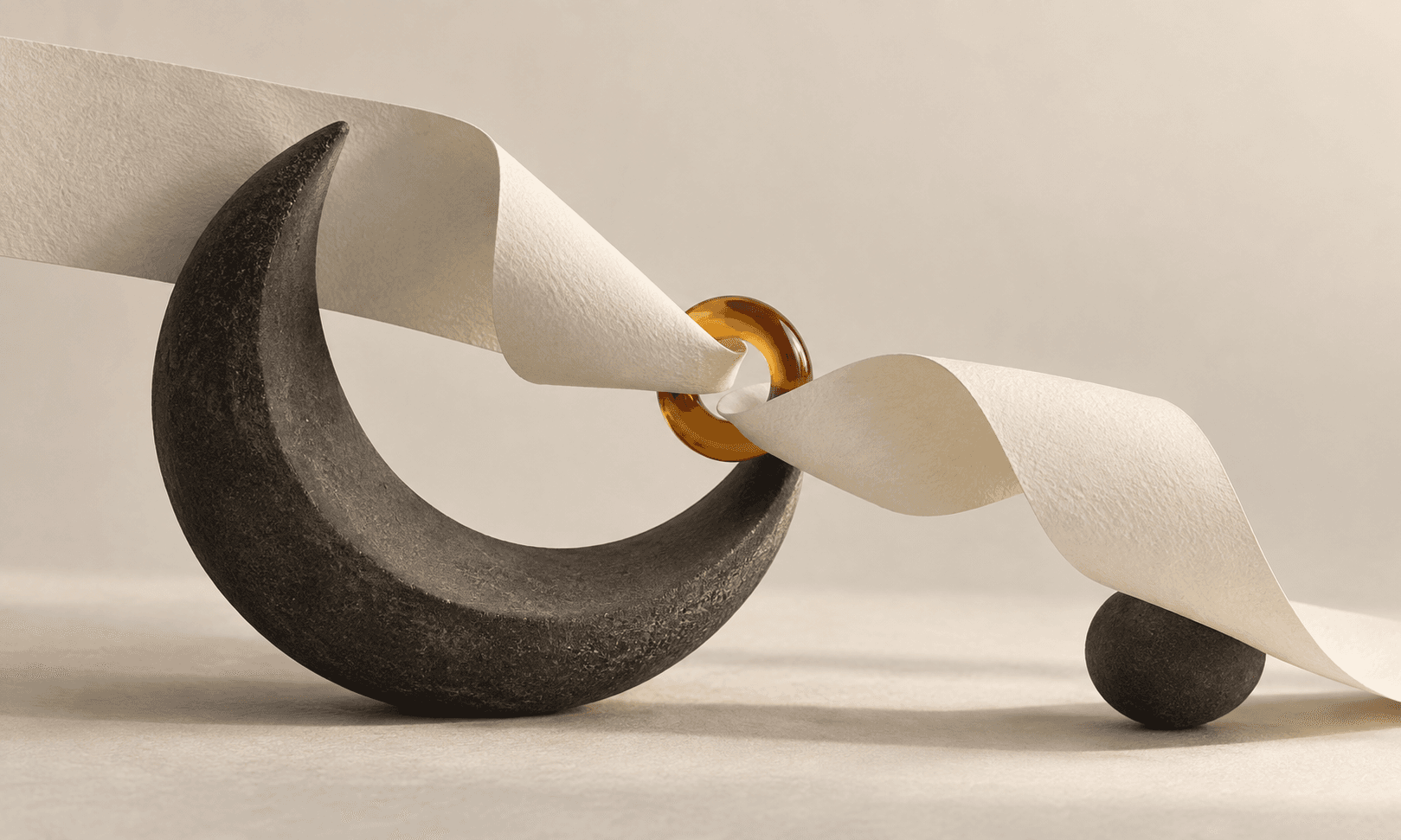 Two folded ivory ribbons meet through an amber ring supported by a charcoal crescent