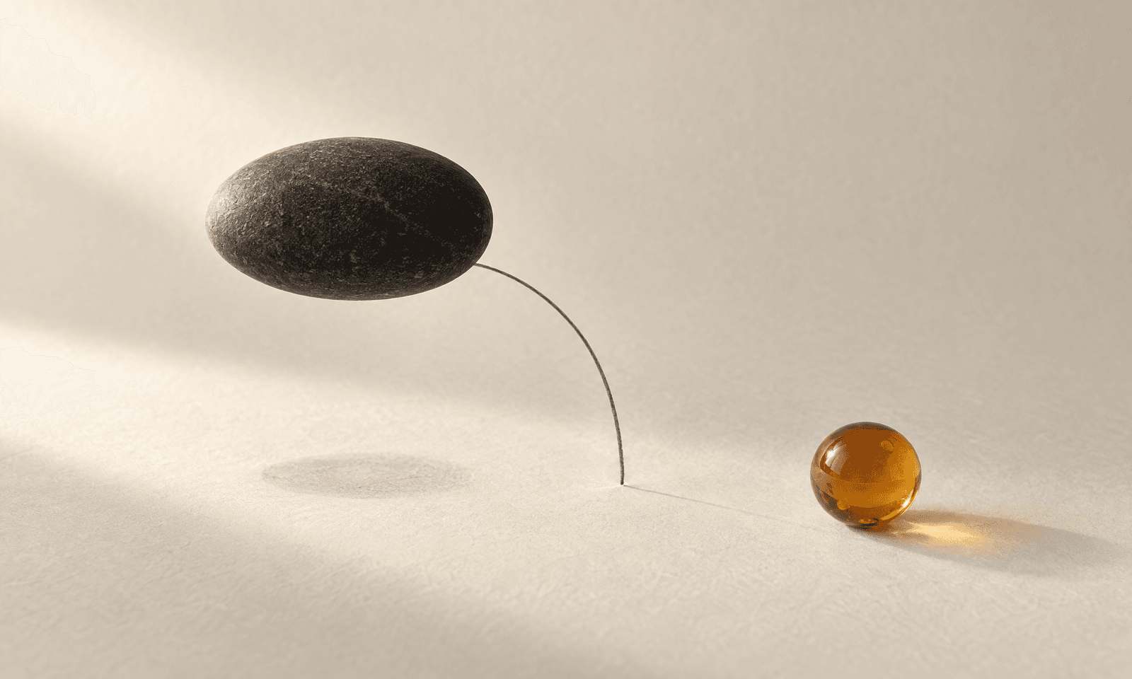 A charcoal pebble lifted above ivory paper by a graphite arc, leaving a soft shadow, with an amber sphere nearby