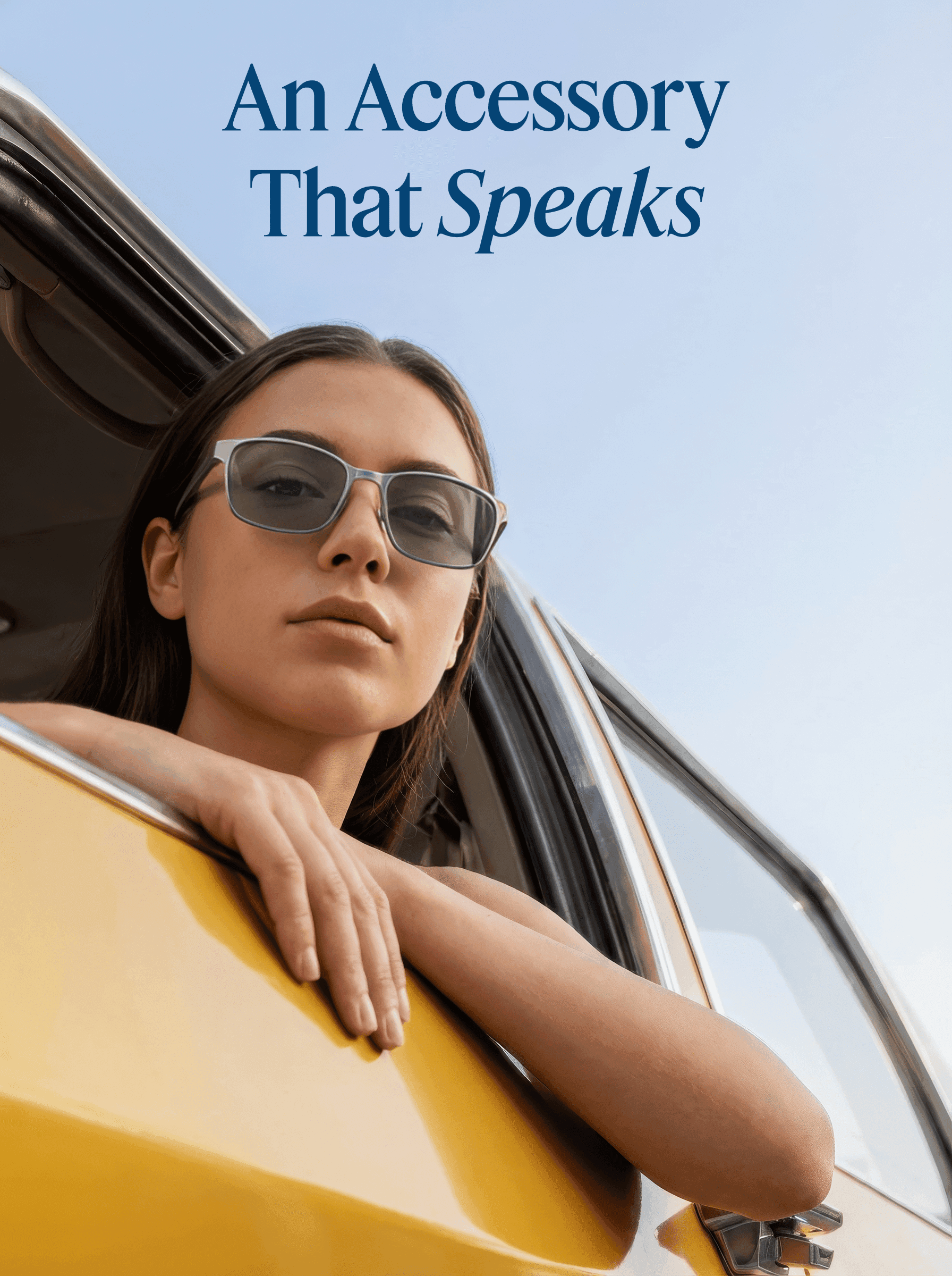 Model wearing smart glasses in a yellow car beneath ‘An Accessory That Speaks’