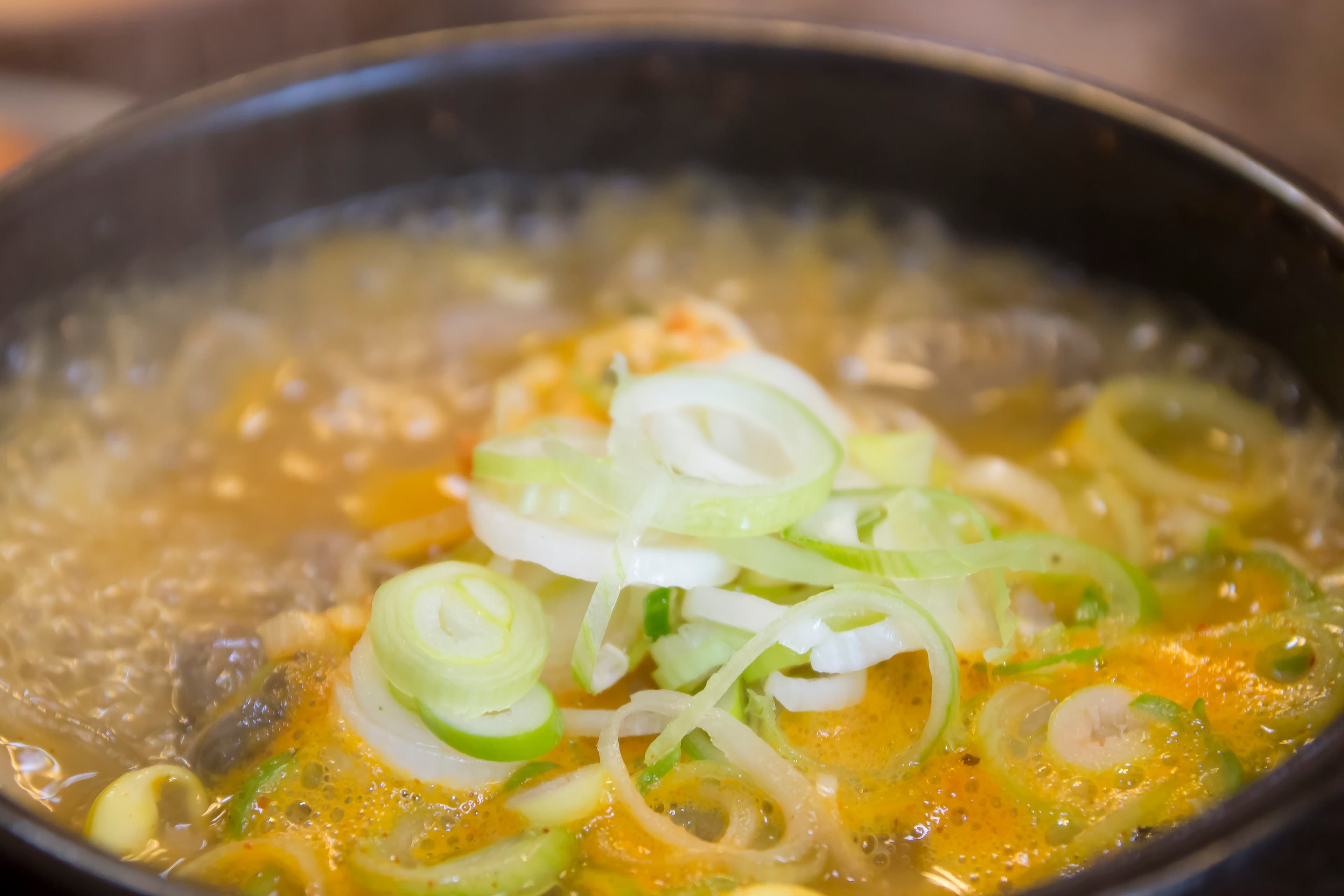 Original Korean sundae soup photograph with visible scallion rings and ingredients