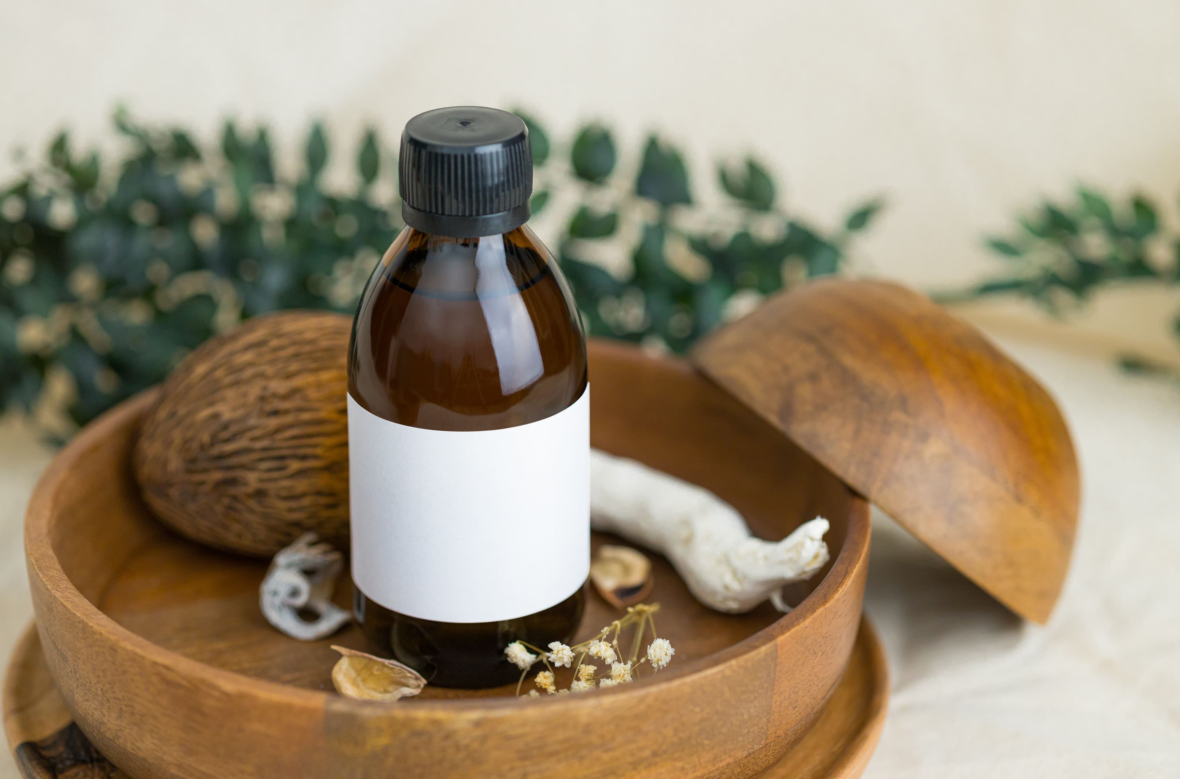 Amber bottle with a blank label on wood